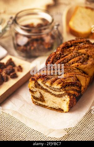Freshly baked sourdough sweet swirl bread walnut babka, twisted loaf bread Stock Photo