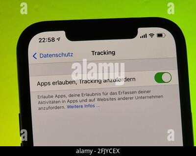 Berlin, Germany. 26th Apr, 2021. Privacy query on an iPhone 12 Pro Max. With the new iPhone operating system iOS 14.5, users can allow or prohibit cross-provider advertising tracking. Tracking can also be prevented with a software switch. Credit: Christoph Dernbach/dpa/Alamy Live News Stock Photo