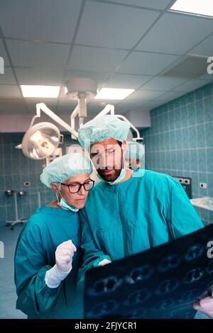 Portrait of intellectual healthcare professionals with at x-ray radiographic image, ct scan, mri Stock Photo