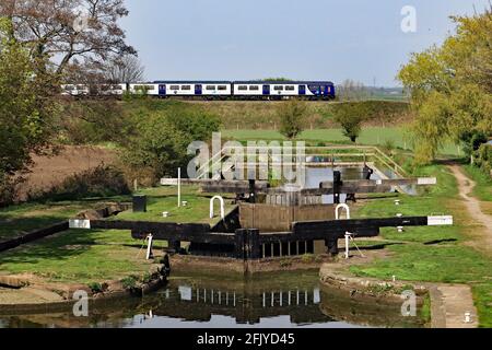 One of Northern’s “new” flexi units passes over the Leeds and Liverpool canal near Burscough in West Lancashire. Stock Photo