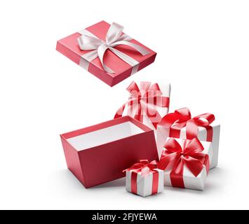 Red opened gift box with group of white gift boxes isolated on white background - clipping path included Stock Photo