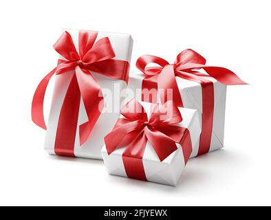 White gift boxes with red bows isolated on white background - clipping path included Stock Photo