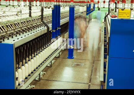 Making cotton thread from raw cotton in Textile Spinning unit. Stock Photo