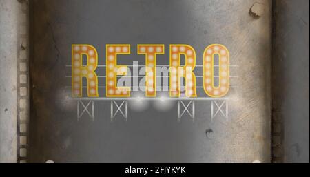 Composition of yellow retro text with lit light bulbs on grey metallic background Stock Photo