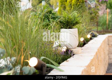 Smart Ambient garden lighting on a bangkirai terrace Stock Photo