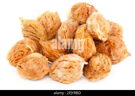 handful of wet peach seed with pulp leftovers isolated on white background Stock Photo
