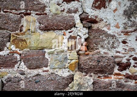 different colored stones in a wall of an old building Stock Photo
