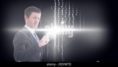 Composition of businessman touching virtual screen with glowing light and letters changing Stock Photo