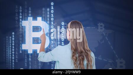 Composition of woman touching virtual screen with bitcoin symbol and binary coding Stock Photo