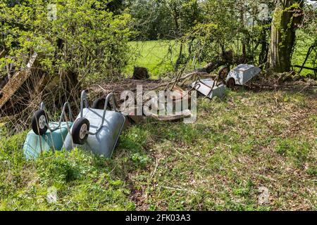 Wheelbarrow graveyard found in a field, Ribble Valley, Lancashire, UK. Stock Photo