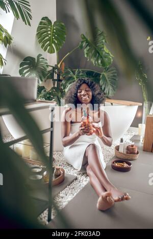 Pretty african american woman with natural beauty products Stock Photo