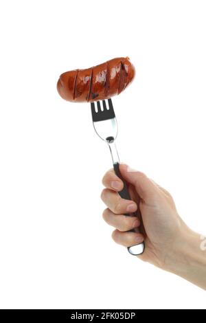 Female hand hold fork with grilled sausage, isolated on white background Stock Photo