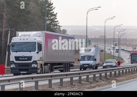 Interstate Highway Ufa - Kazan M7, Russia - Apr 23th 2021. The MAN truck of the Wildberries company transports clothes and shoes. Truck move along the Stock Photo