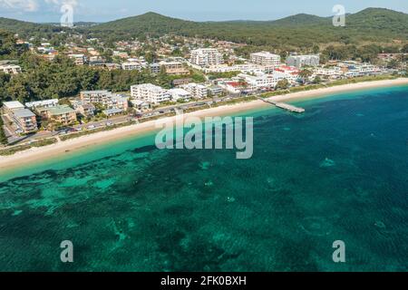 Aerial view of Shoal Bay foreshore, wharf and town centre with the aqua waters of Port Stephens, Australia. Stock Photo