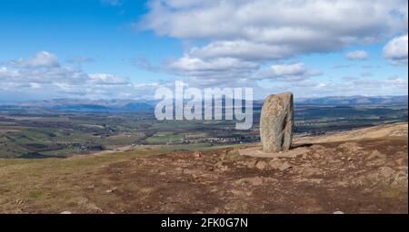 Dumgoyne summit marked by a standing stone overlooking Loch Lomond, Ben Lomond and Arrochar Alps, Stirling, Scotland, UK Stock Photo