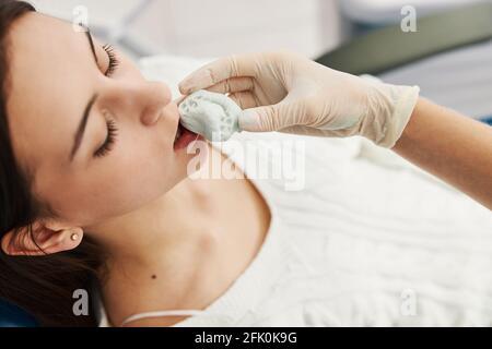 Orthodontist using dental putty to make teeth impressions of a patient  Stock Photo - Alamy