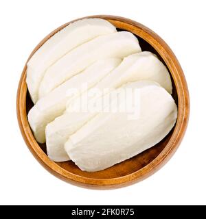 Thick cut, fresh mozzarella slices, in a wooden bowl. Italian cheese, with high moisture. Dairy product, used for pizza, pasta dishes or Caprese Salad. Stock Photo
