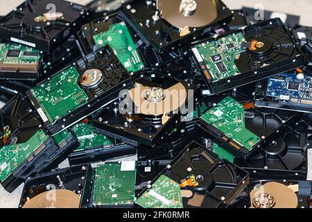 many computer hard drives lie on top of each other to destroy data Stock Photo