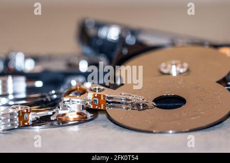 many computer hard drives lie on top of each other to destroy data Stock Photo