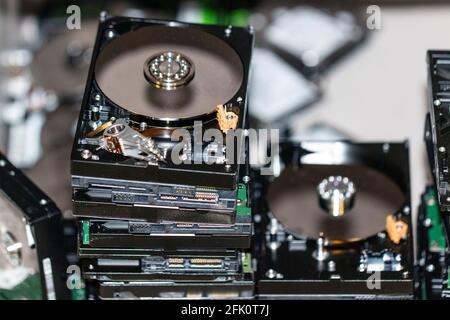 many computer hard drives lie on top of each other to destroy data Stock Photo