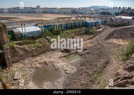 A derelict site beside the Grand Hotel on Llandudno pier waiting for re-development. Pier Pavillion site. Stock Photo