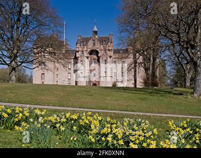 Front view of Fyvie Castle with daffodils Stock Photo