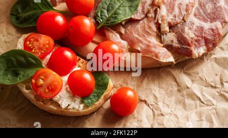 Fresh bruschetta on craft paper. Delicious snack Stock Photo