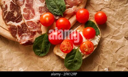 Fresh bruschetta on craft paper. Delicious snack Stock Photo