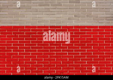 Gray and red brick wall. With copy space to use as a background or designs. Symbolism. Color of ribbon for awareness day Stock Photo