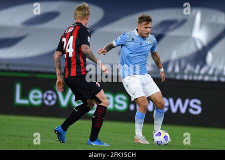 Rome, Italy. 26th Apr, 2021. Ciro Immobile (R) of SS Lazio in action during the Serie A soccer match between SS Lazio and AC Milan Stadio Olimpico on April 26, 2021 in Rome, Italy. (Photo by Roberto Ramaccia/INA Photo Agency) Credit: Sipa USA/Alamy Live News Stock Photo
