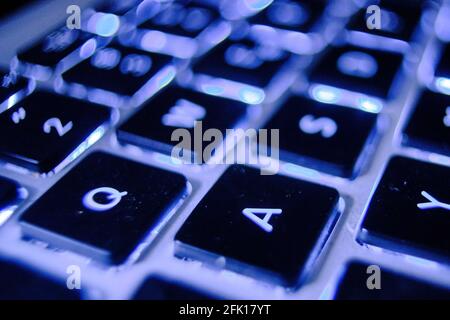 Berlin, Germany. 19th Mar, 2021. The letters "Q" and "A" are sharply depicted on the blue glowing keyboard of a laptop. Q and A stands for "questions and answers". Credit: Stefan Jaitner/dpa/Ģ����ý Live News Stock Photo