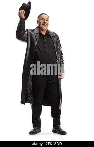 Full length portrait of a mature man in a trench coat greeting with his hat isolated on white background Stock Photo