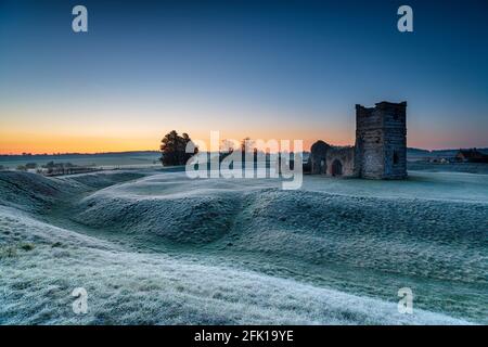 A frosty dawn over the old church at Knowlton near Wimborne in the Dorset countryside Stock Photo