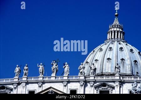 Statues on Bernini's colonnade, and dome of St. Peter's Basilica,Vatican, Rome, Italy. Stock Photo