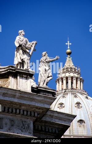 Statues on Bernini's colonnade, and dome of St. Peter's Basilica,Vatican, Rome, Italy. Stock Photo