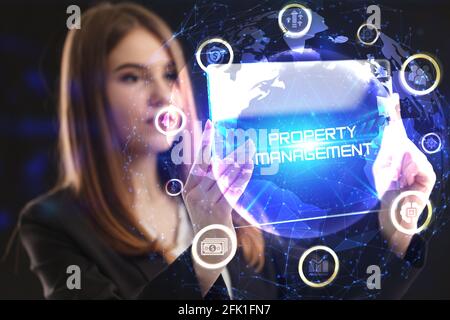 Business, Technology, Internet and network concept. Young businessman working on a virtual screen of the future and sees the inscription: Property man Stock Photo