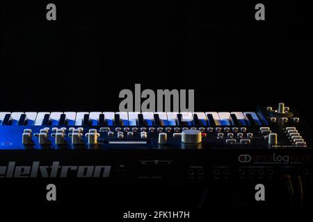 Complex synth keyboard in stage lighting Stock Photo