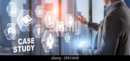 Businessman pressing case study button on virtual screens. Stock Photo