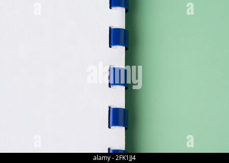 Open blank spiral spring bound notepad. Minimal Flat Lay mockup Stock Photo