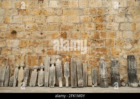 Old muslim headstones near the wall in mosque yard in Selcuk town, Turkey Stock Photo