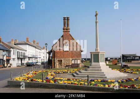 Aldeburgh war memorial, view in summer of the war memorial cross and 16th century Moot Hall sited on the Aldeburgh seafront, Suffolk, England, UK Stock Photo