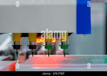 Automatic SMD pick and place machine assembling computer circuit board Stock Photo