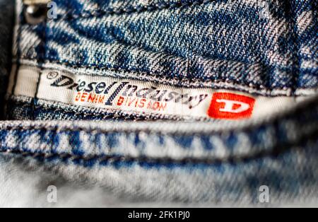 Rome, Italy, April 2021: Detail of the Diesel Industry logo sewn on the front pocket of a pair of jeans trousers. Diesel is Italian fashion multina Stock Photo - Alamy