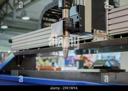 Plasma cutting machine working with sheet metal at metalworking exhibition Stock Photo