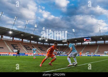 LUBIN, POLAND - APRIL 24, 2021: Football match Polish PKO Ekstraklasa between KGHM Zaglebie Lubin vs Piast Gliwice 2:2. In action Lukasz Lakomy (L) Kr Stock Photo