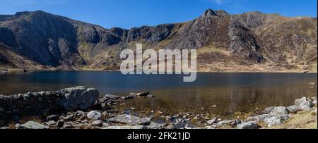 Panoramic view of the lake known as Llyn Idwal and the mountain Y Garn, the tenth highest peak in Wales UK Stock Photo