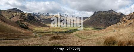 Panoramic view from the lower slopes of Side Pike looking up Oxendale and Mickleden. Pike O'Blisco, Crinkle Crags, Bow Fell and the Langdale Pikes all Stock Photo