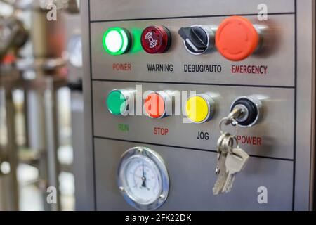 Machine control panel with push buttons and switches at factory Stock Photo