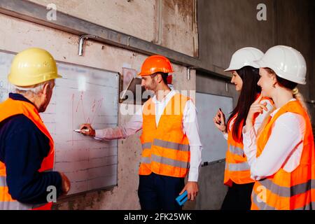 The engineers enjoy the work at the enterprise Stock Photo