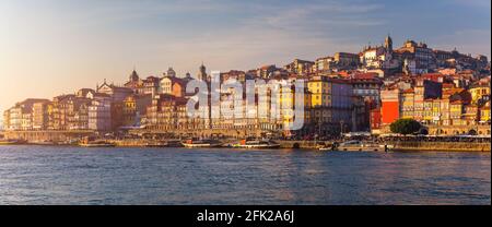 Colorful houses of Porto Ribeira, traditional facades, old multi-colored houses with red roof tiles on the embankment in the city of Porto, Portugal Stock Photo